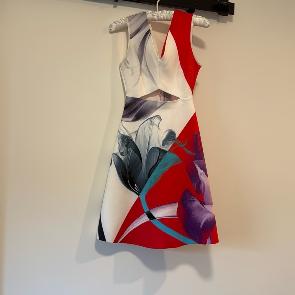 Clover Canyon 
Size XS
Used 
Front cutout, flower image